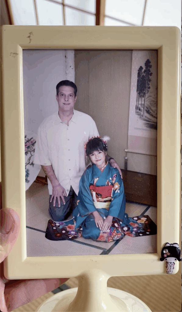 Child wearing kimono with her father in Los Angeles, childhood photo before her future seijin celebration